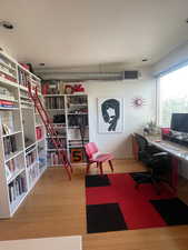 Home office featuring wood finished floors