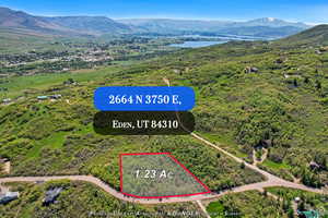 Aerial overview of property's location featuring property boundaries highlighted and a water and mountain view
