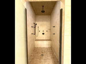 Bathroom featuring tiled shower