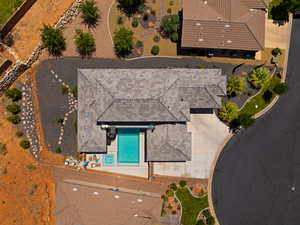 View of subject property featuring a pool