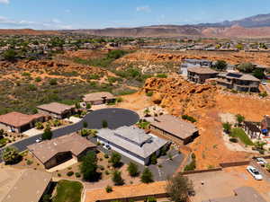 Aerial view of residential area featuring a mountainous background