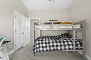 Carpeted bedroom with baseboards
