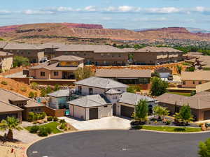 Aerial view of residential area featuring mountains