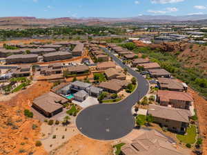 Aerial perspective of suburban area with a mountainous background