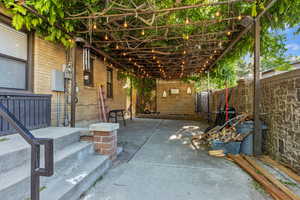 Fenced backyard with a patio area