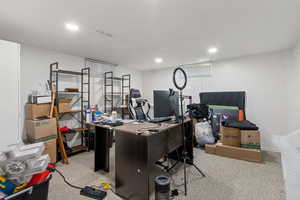 Carpeted home office featuring recessed lighting