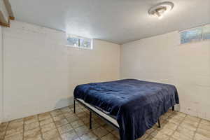 Bedroom featuring a textured ceiling