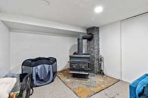 Detailed view of a wood stove and carpet flooring