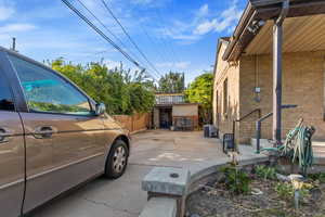 View of home's exterior featuring central AC and brick siding