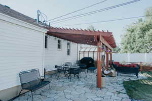 Fenced backyard featuring a pergola, a patio area, an outdoor living space, outdoor dining space, and a grill