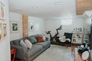 Living area with wood finished floors and recessed lighting