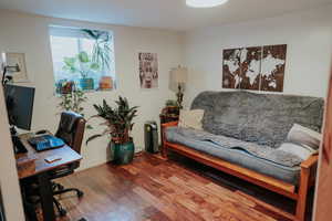 Home office featuring wood finished floors