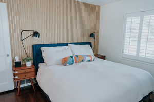 Bedroom featuring dark wood-style floors