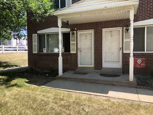 Property entrance with brick siding