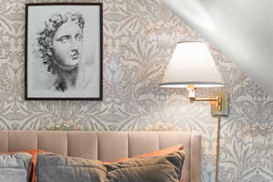 Living area with wallpapered walls