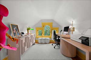 Office area featuring vaulted ceiling