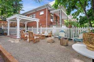 View of patio / terrace with a pergola and a fire pit