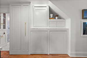 Detailed view of wood finished floors and baseboards