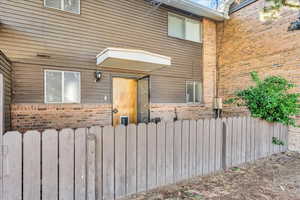 Property entrance with brick siding