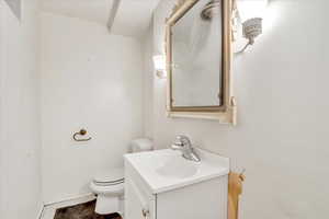Half bath with vanity and toilet