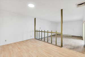 Unfurnished room featuring wood finished floors