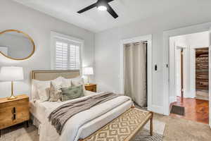 Carpeted bedroom with ceiling fan