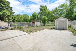Fenced backyard with a patio area