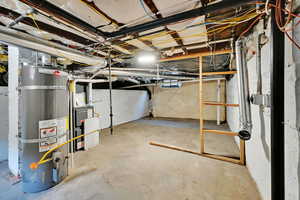 Unfinished below grade area with strapped water heater