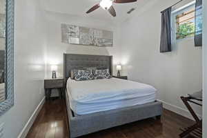 Bedroom featuring dark wood-type flooring and ceiling fan