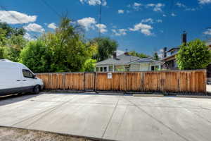 View of patio featuring a gate