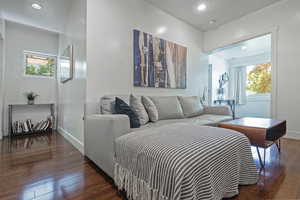 Bedroom with recessed lighting and dark wood-type flooring