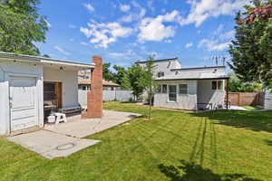 View of yard with a patio area and an outdoor structure