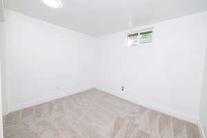 Spare room with carpet floors and baseboards