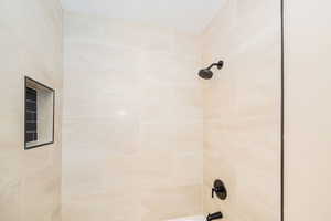 Bathroom view of shower / bathtub combination