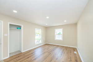 Unfurnished bedroom featuring light wood-style flooring, baseboards, and recessed lighting