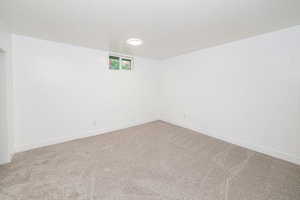 Spare room with carpet floors and baseboards