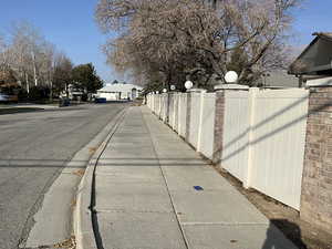 View of asphalt street with sidewalks and curbs
