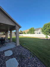 View of the yard and back patio. Taken at 6 pm.