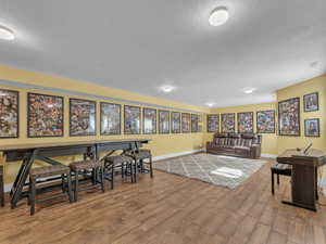Great room with lots of possibilities and wood finish porcelain tile floors.