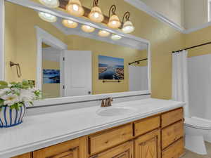 Full bath with vanity, toilet, a shower with shower curtain, and tile patterned flooring