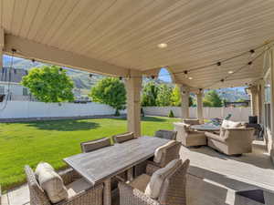 View of patio / terrace featuring outdoor lounge area and outdoor dining space. Taken at 10 am.