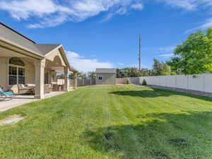 View of yard featuring an outdoor living space and a patio