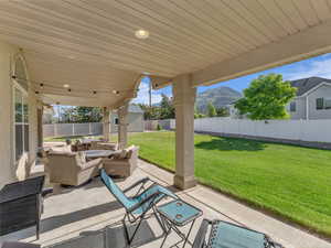 View of patio / terrace with an outdoor hangout area and a mountain view. Taken at 10 am.