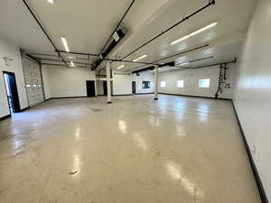 Garage featuring baseboards