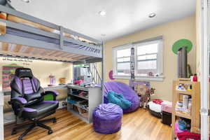 Bedroom featuring hardwood / wood-style floors and recessed lighting