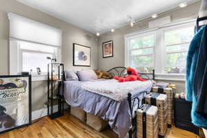 Bedroom featuring wood finished floors