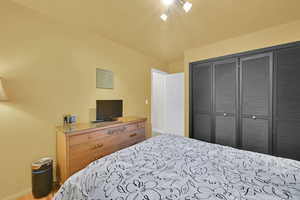 Bedroom featuring baseboards and a closet