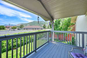 Wooden deck featuring a mountain view
