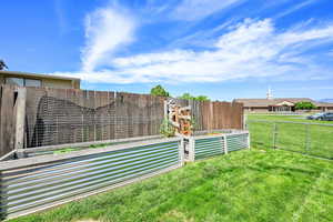 View of yard with a vegetable garden