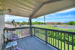 Deck with a mountain view and a residential view